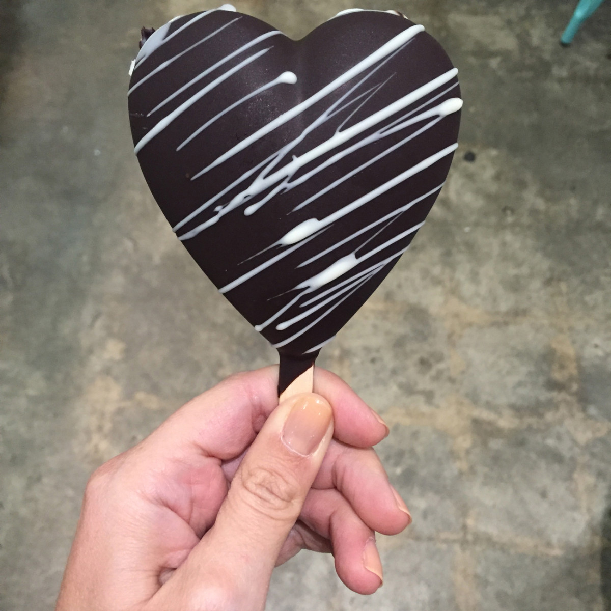 {Favorite new dessert: heart-shaped frozen yogurt dipped in dark chocolate}