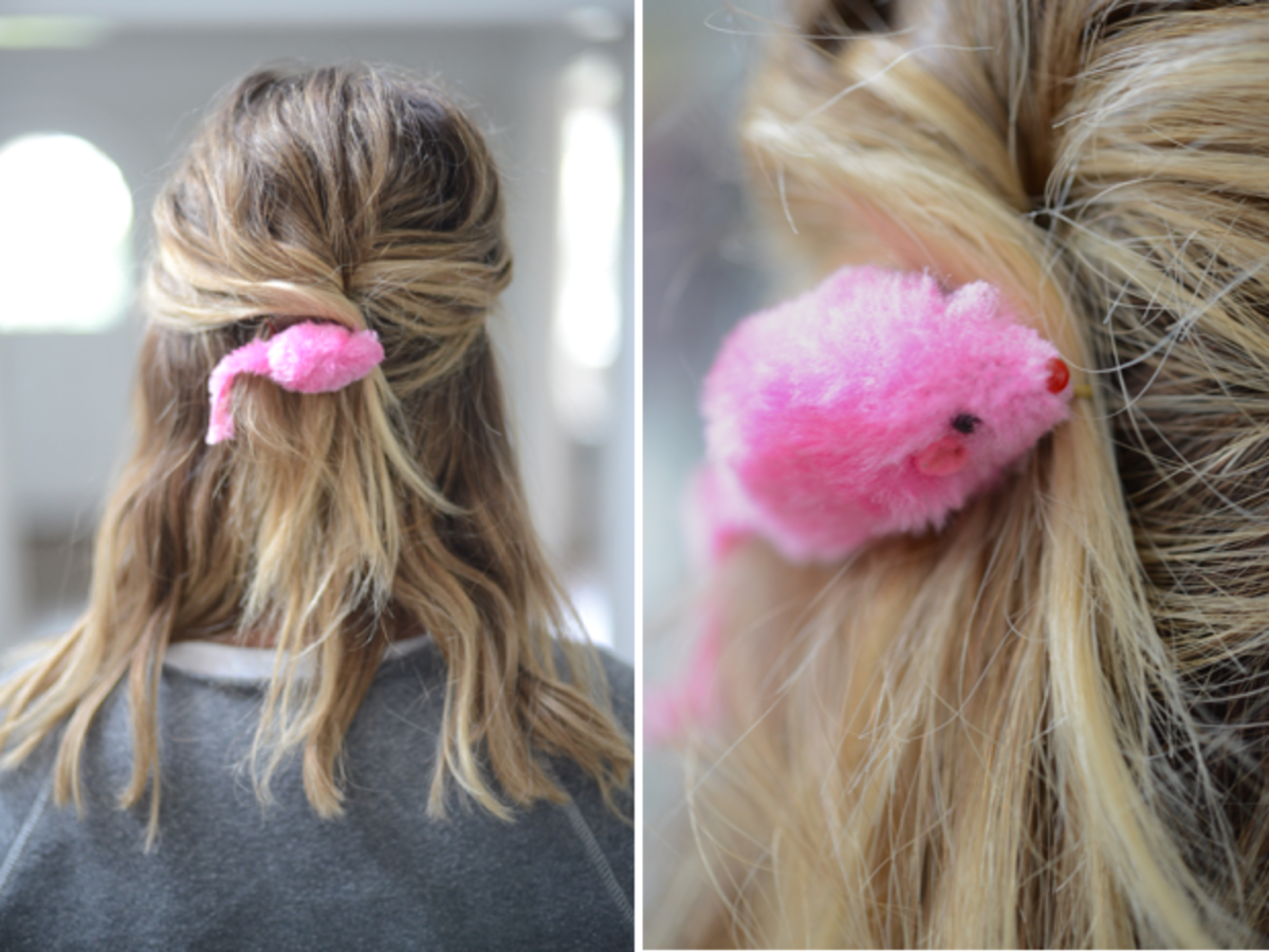 {A playful touch to a simple updo: Cali's favorite mouse toy affixed to a hair clip}