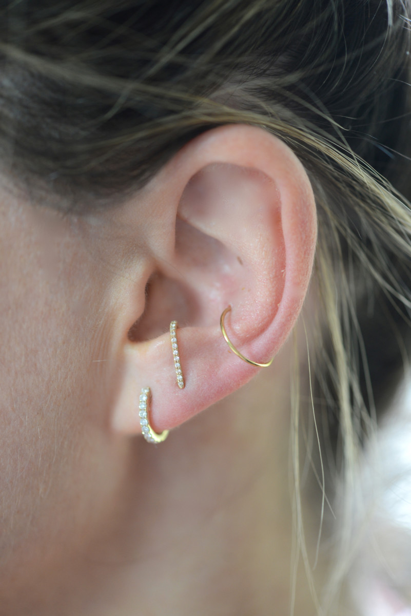 Current ear situation. Left to right: XIV Karats diamond huggies, Smith + Mara suspender earring c/o, no name gold hoop