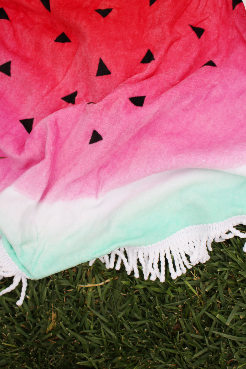 {An adorable watermelon picnic blanket for outdoor gatherings}