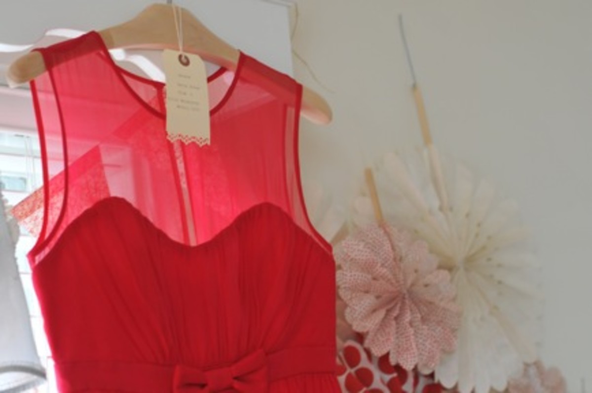 {I loved the sheer fabric and ruching on this red party dress}