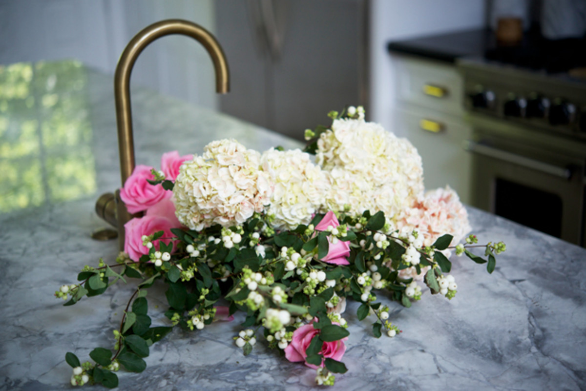  {Kitchen sink filled with flowers for a book shoot}