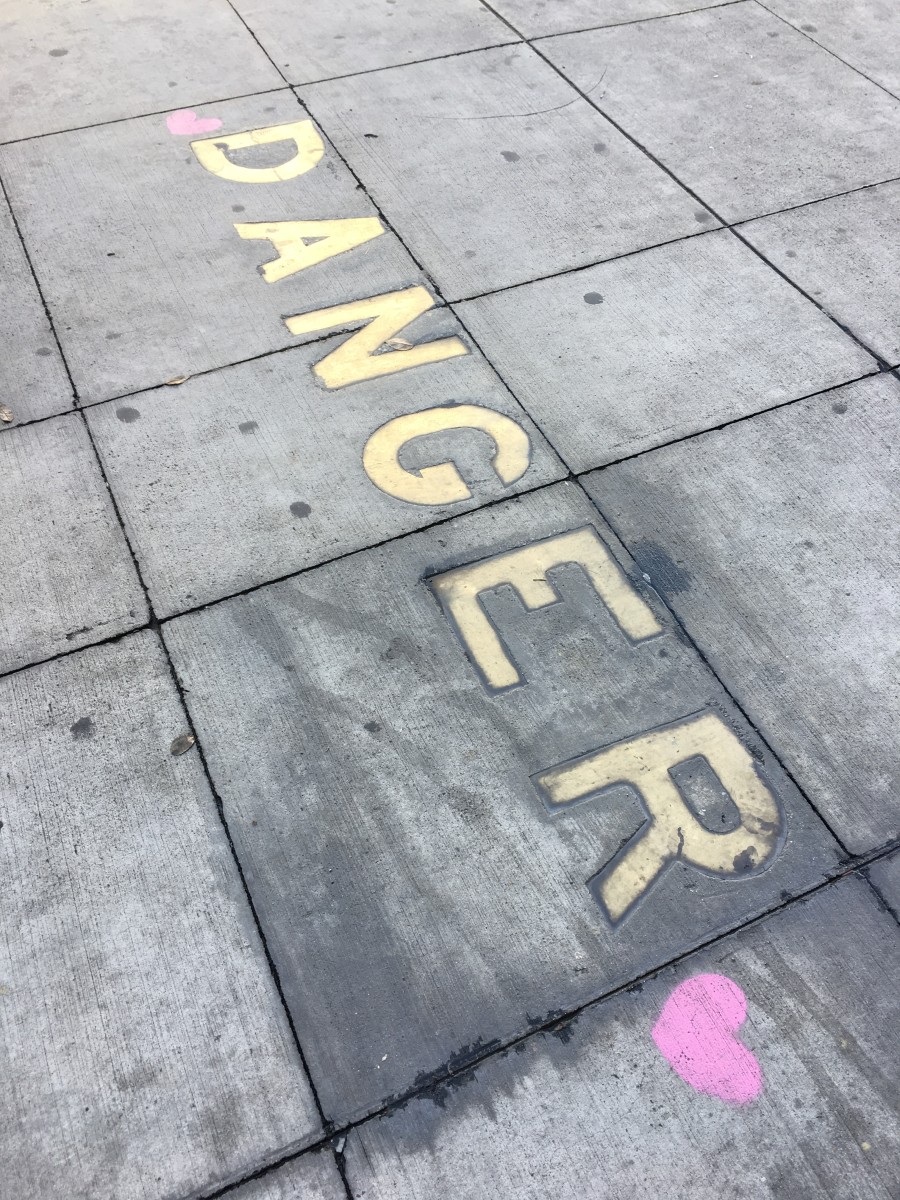 {Friendly reminder from the L.A. downtown sidewalk: Love is a battlefield}
