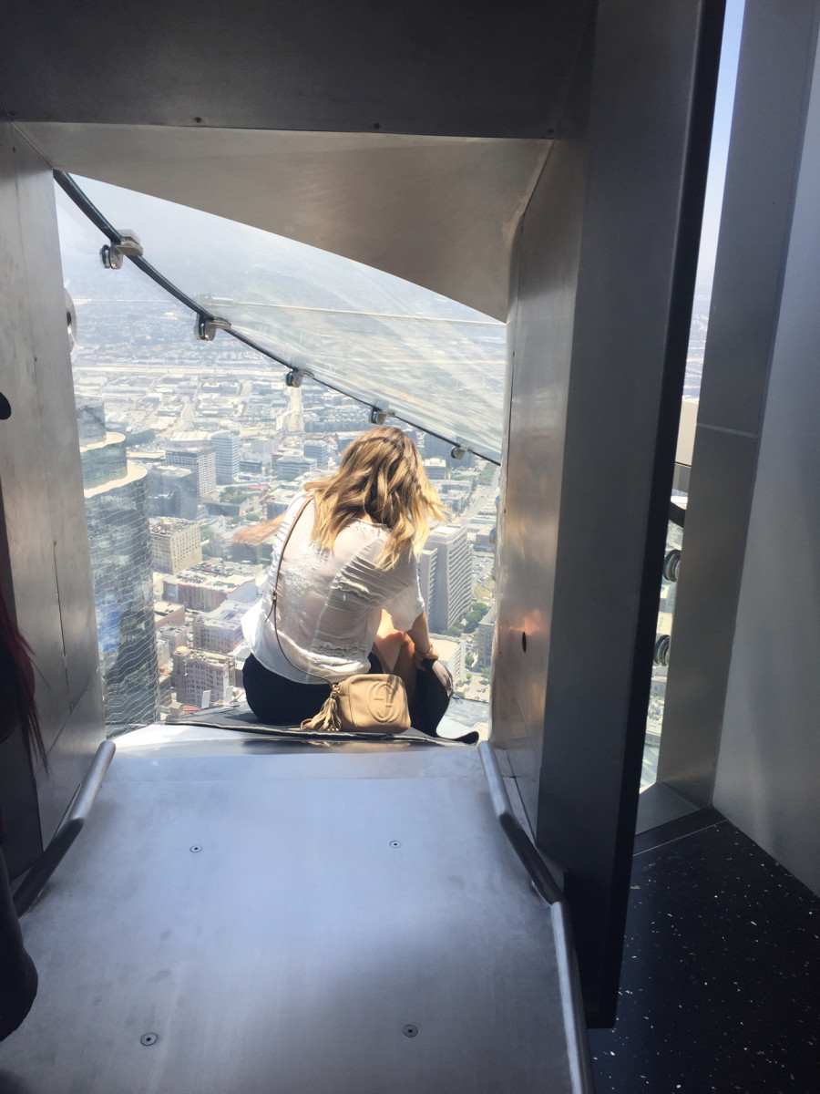 {Going down Skyspace, an outdoor slide 70 stories up - you can watch our Facebook Live videos here}
