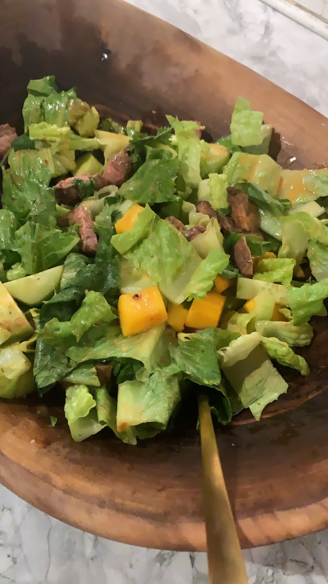 Not a beautiful photo, but a simple salad I made from mango, storebought dressing, and steak.