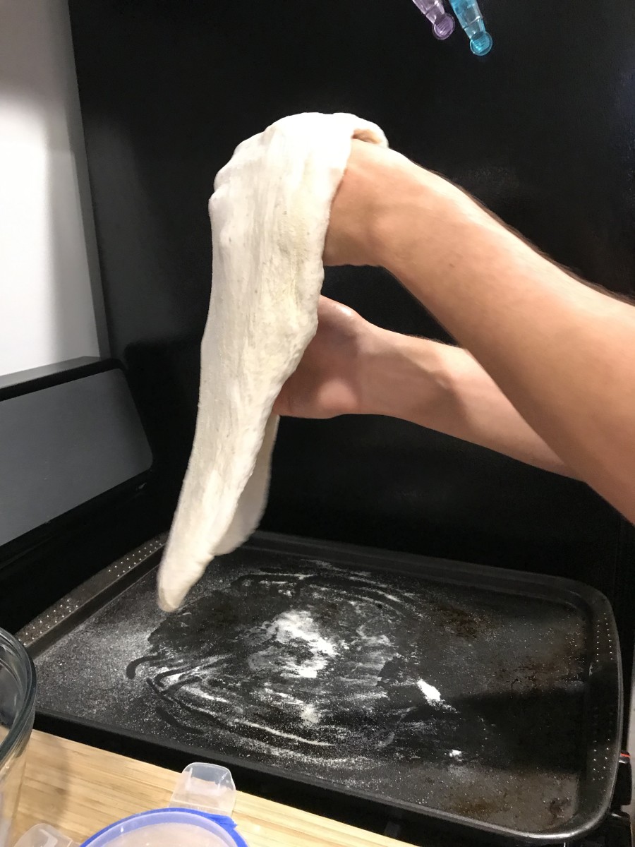 I was quickly kicked off of dough duty after ripping it several times...
