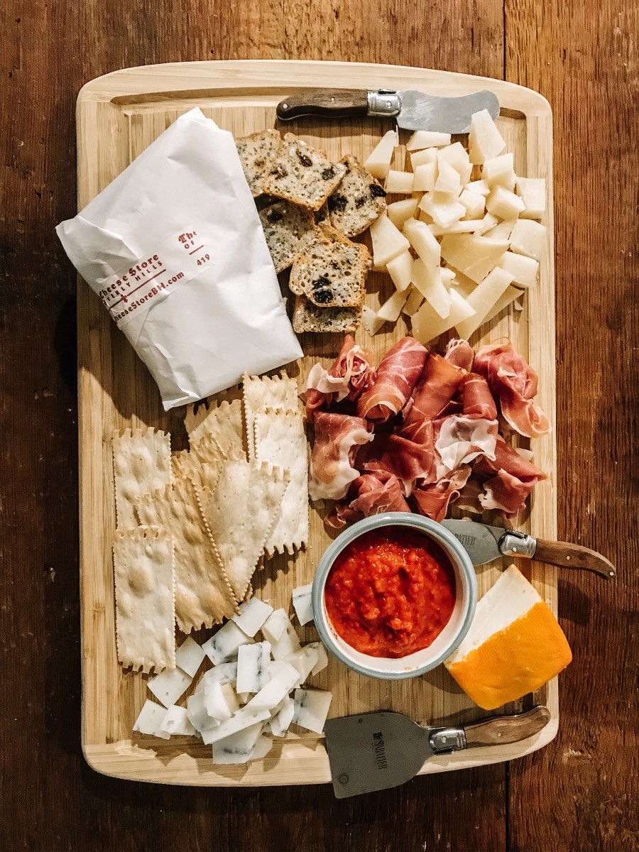 I built a last-minute cheese board with the red pepper spread, port salut, and crisps! 