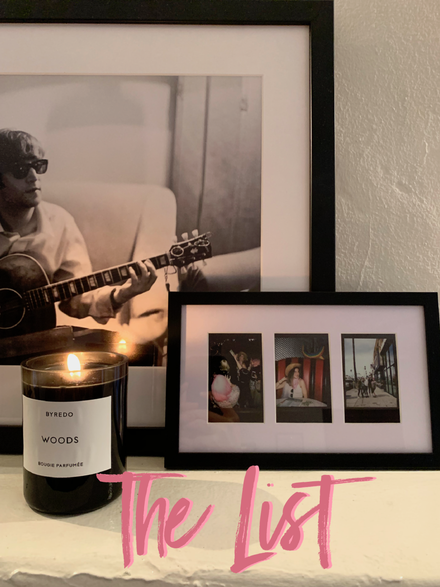 Recent update to the mantle: A collection of Polaroids from my Bachelorette party and a Byredo 'Woods' candle