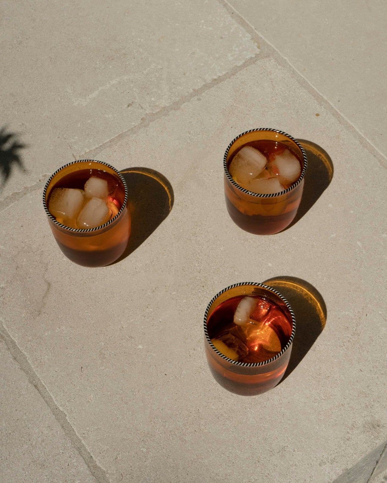 AMBER GLASS WITH BLACK AND WHITE TWISTED RIM - Shop Cupcakes and Cashmere